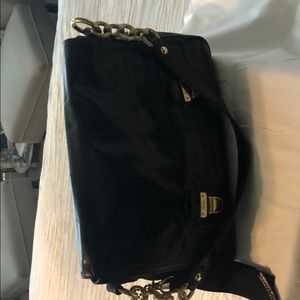Coach handbag in black leather for evening wear.